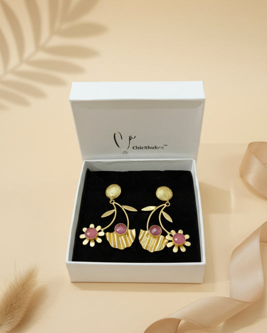 Gold earrings with pink stones in a ChicShubh box