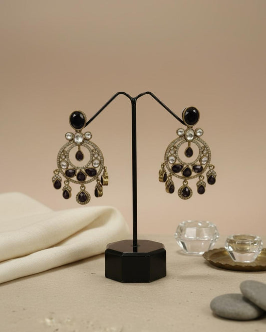 ChicShukra gold‑tone imitation jewellery earrings with black and white stones on a black display stand