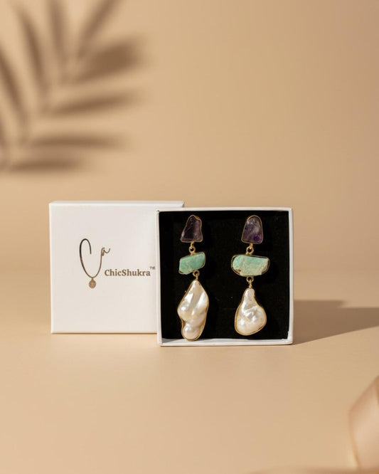 ChicShukra brass earrings with amethyst, green stone, and pearl drops in a white branded jewellery box