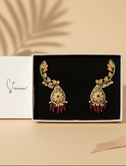 ChicShukra gold-toned Kundan meenakari earrings with red bead drops and mirror stones in a black jewellery box